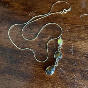 Gold necklace with three-stone pendant